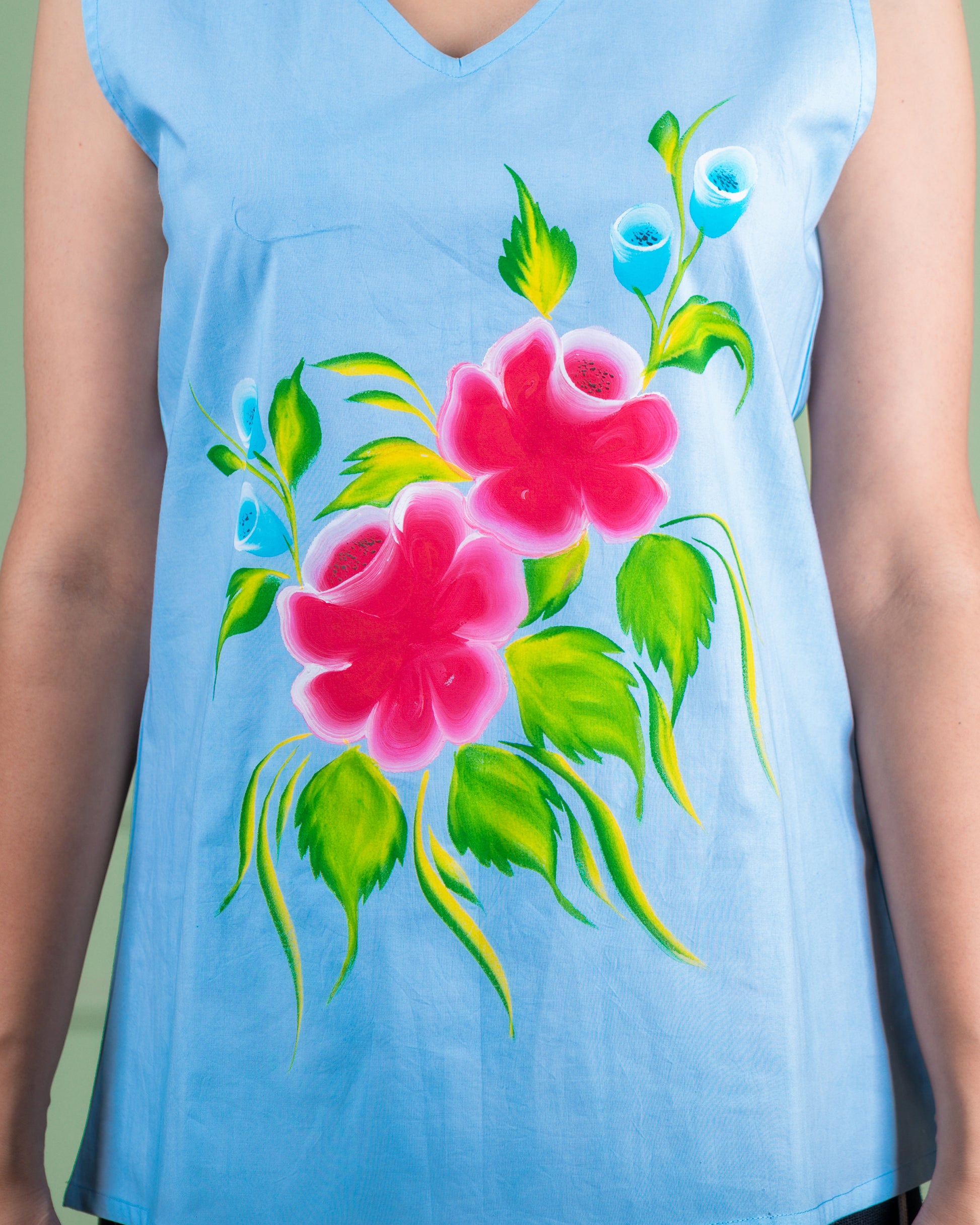 Breathable cotton top with hand-painted floral details, eco-friendly and unique