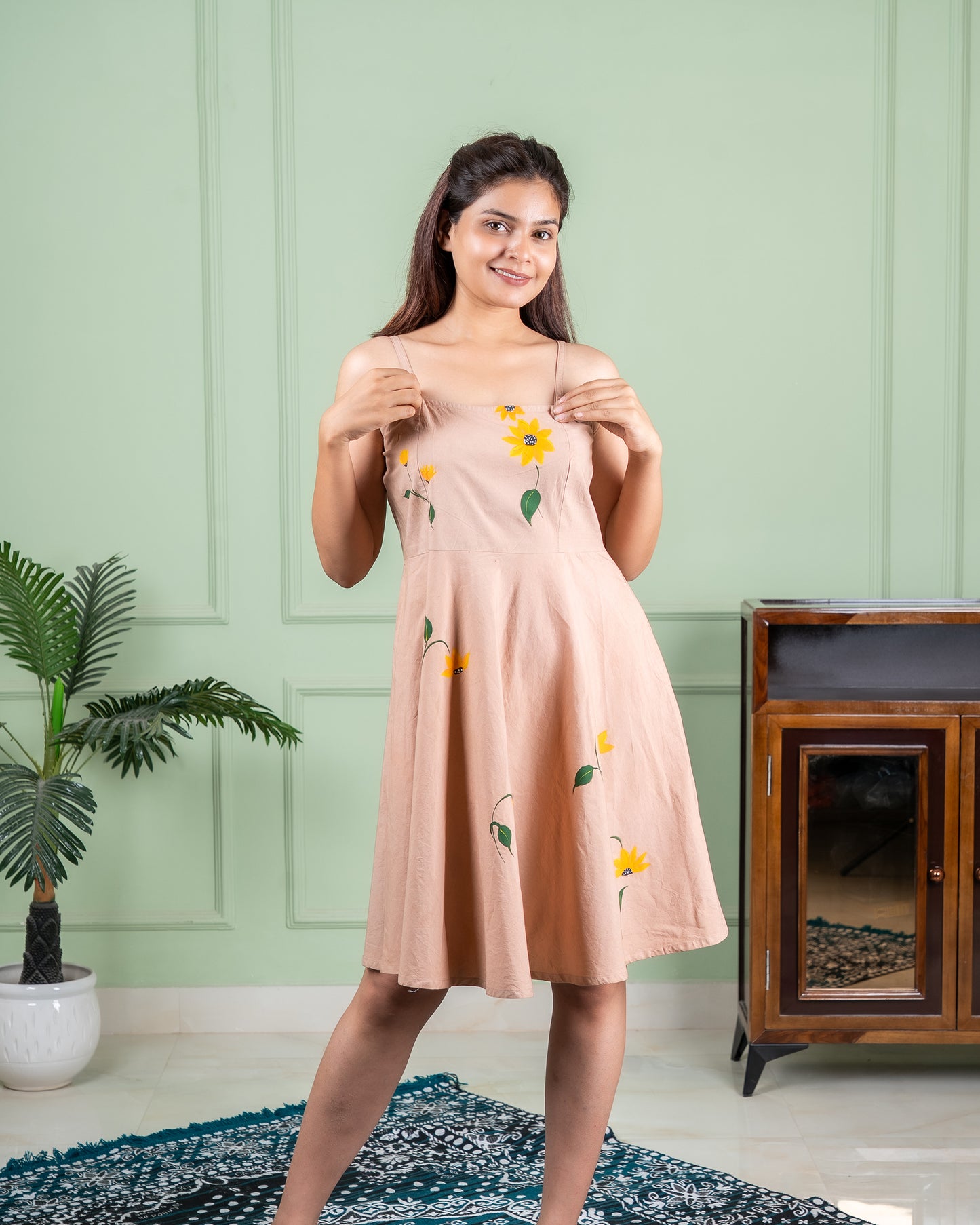 Hand-painted cotton dress with delicate floral artwork in soft colors