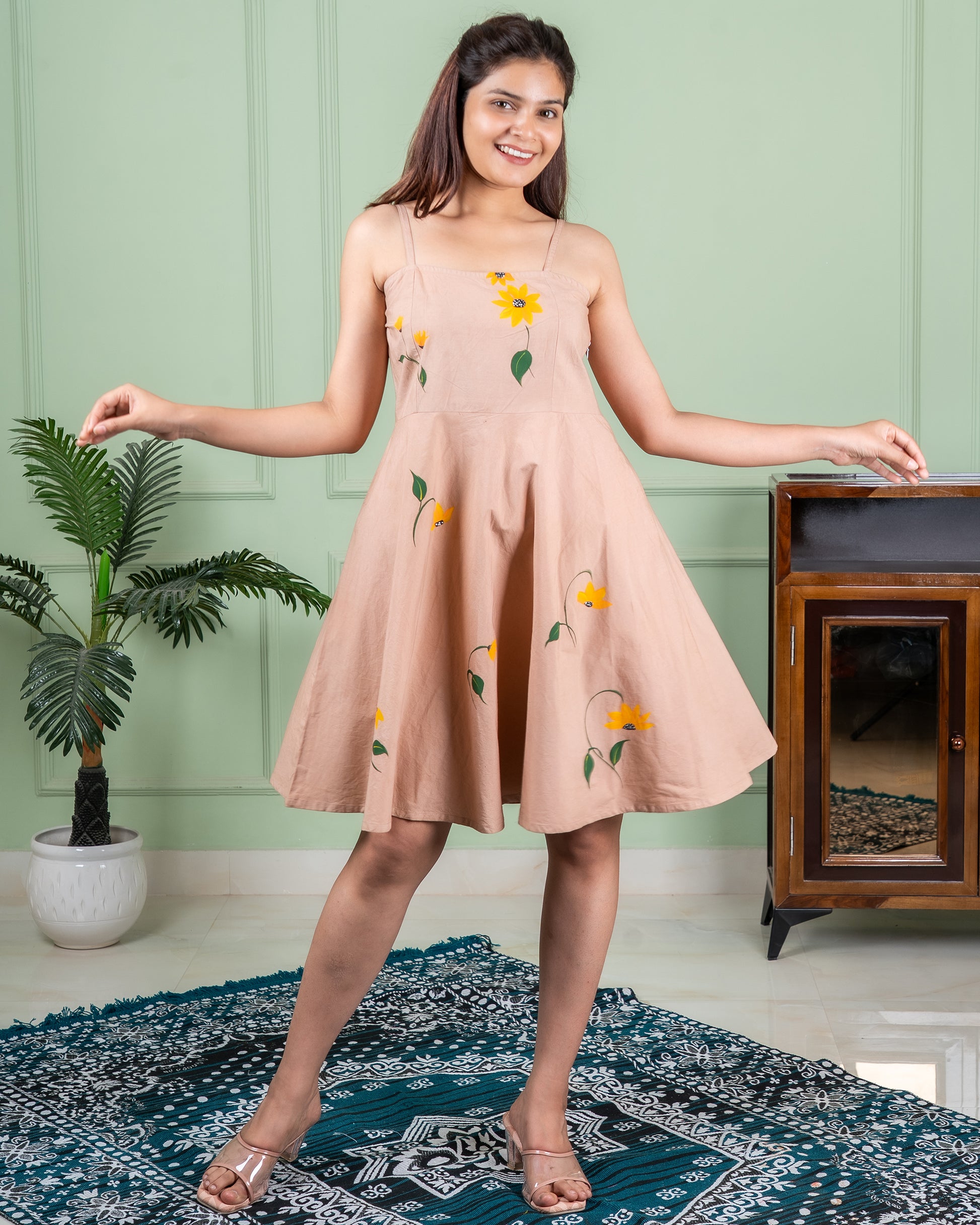 Hand-painted cotton dress with delicate floral artwork in soft colors