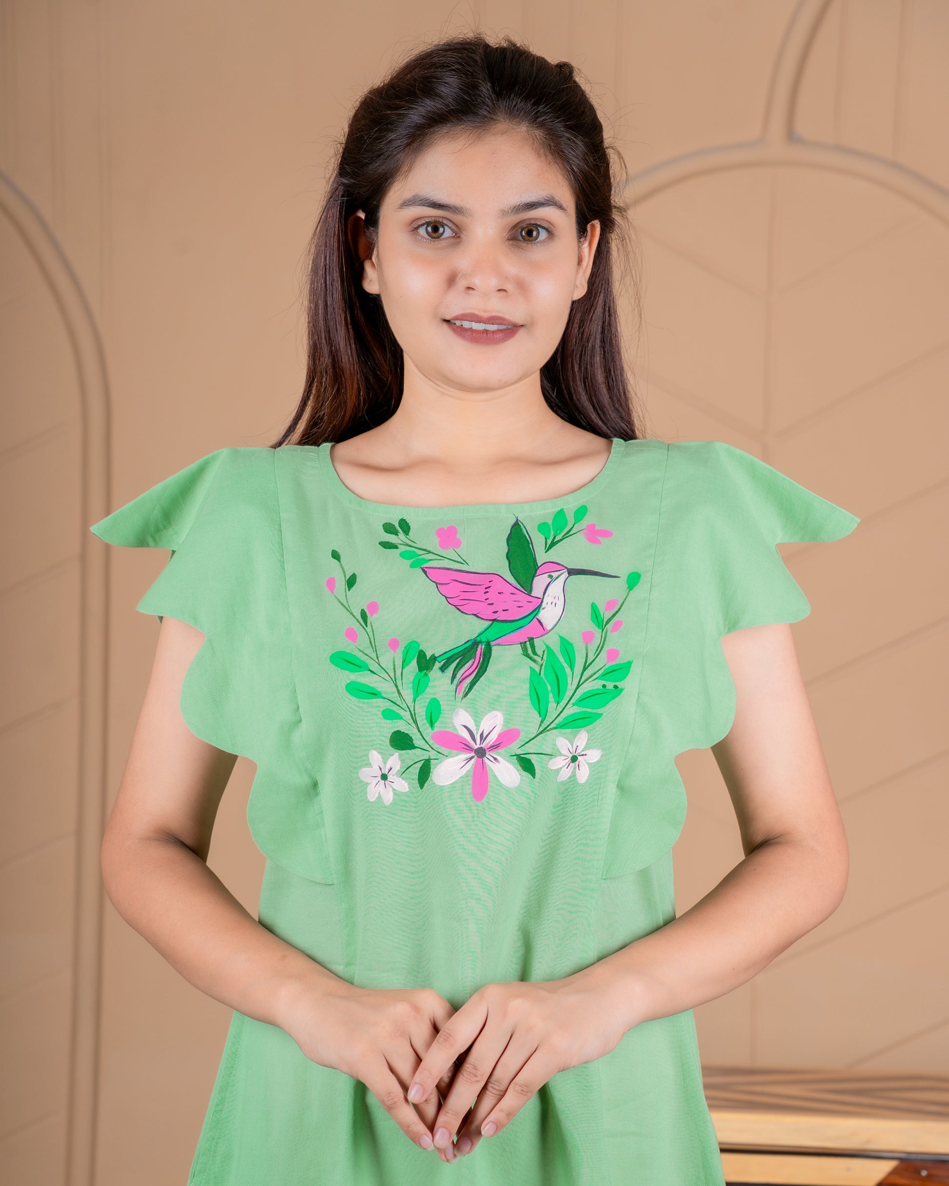 Hand-painted cotton dress with delicate floral artwork in soft colors