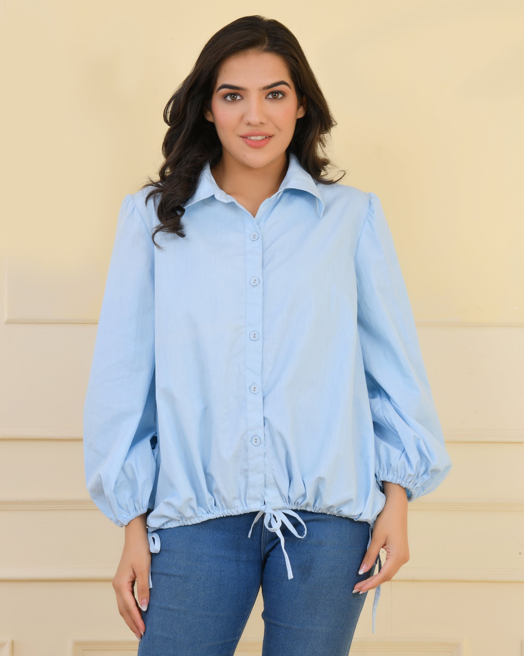 Poplin shirt with smocking at back, balloon sleeves, and tie-up strings on sleeves and hem for a balloon silhouette