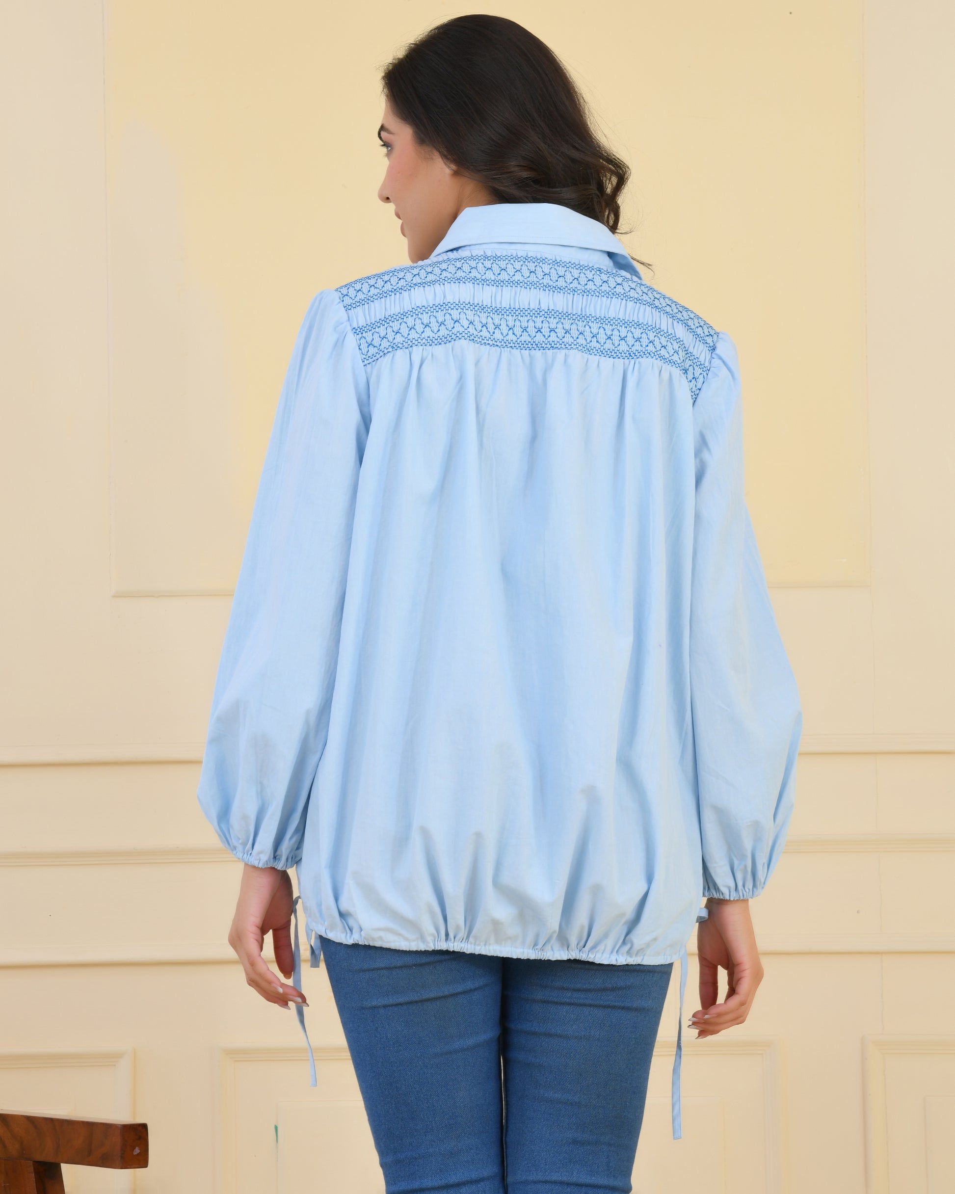 Poplin shirt with smocking at back, balloon sleeves, and tie-up strings on sleeves and hem for a balloon silhouette