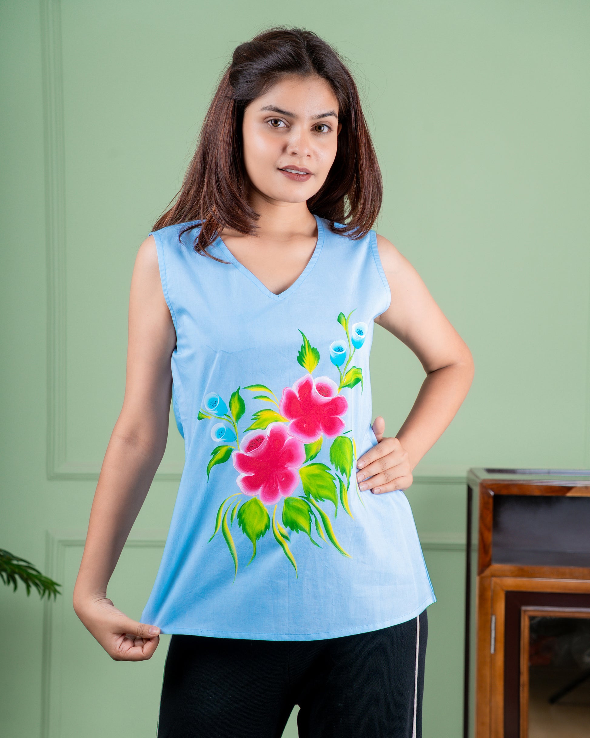 Breathable cotton top with hand-painted floral details, eco-friendly and unique